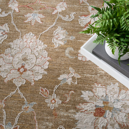 Brown floral area rug with cream and pale pink flowers; white tray with a green potted plant on top.