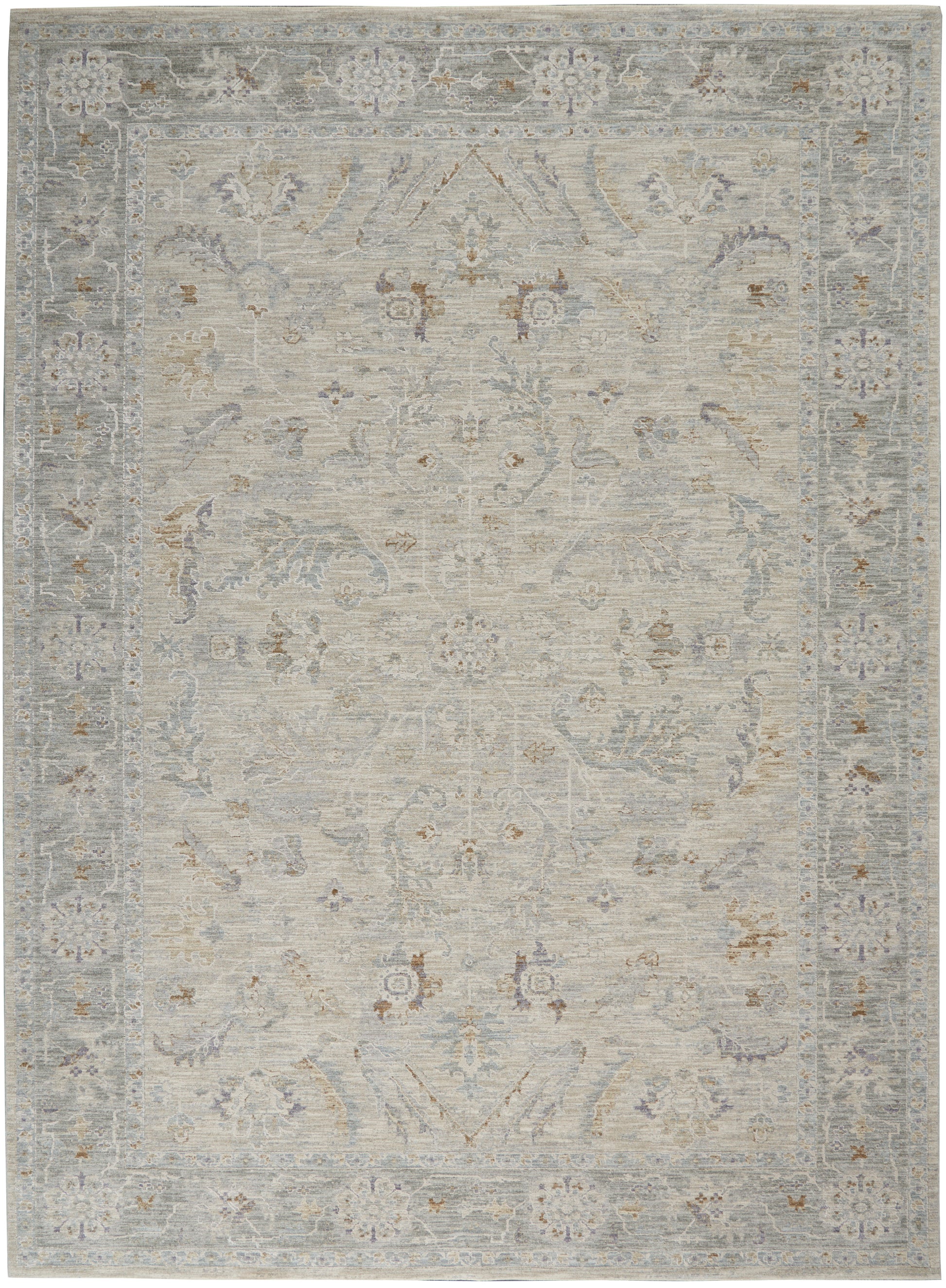 Distressed light-gray oriental rug with pale blue and beige florals and ornate border.