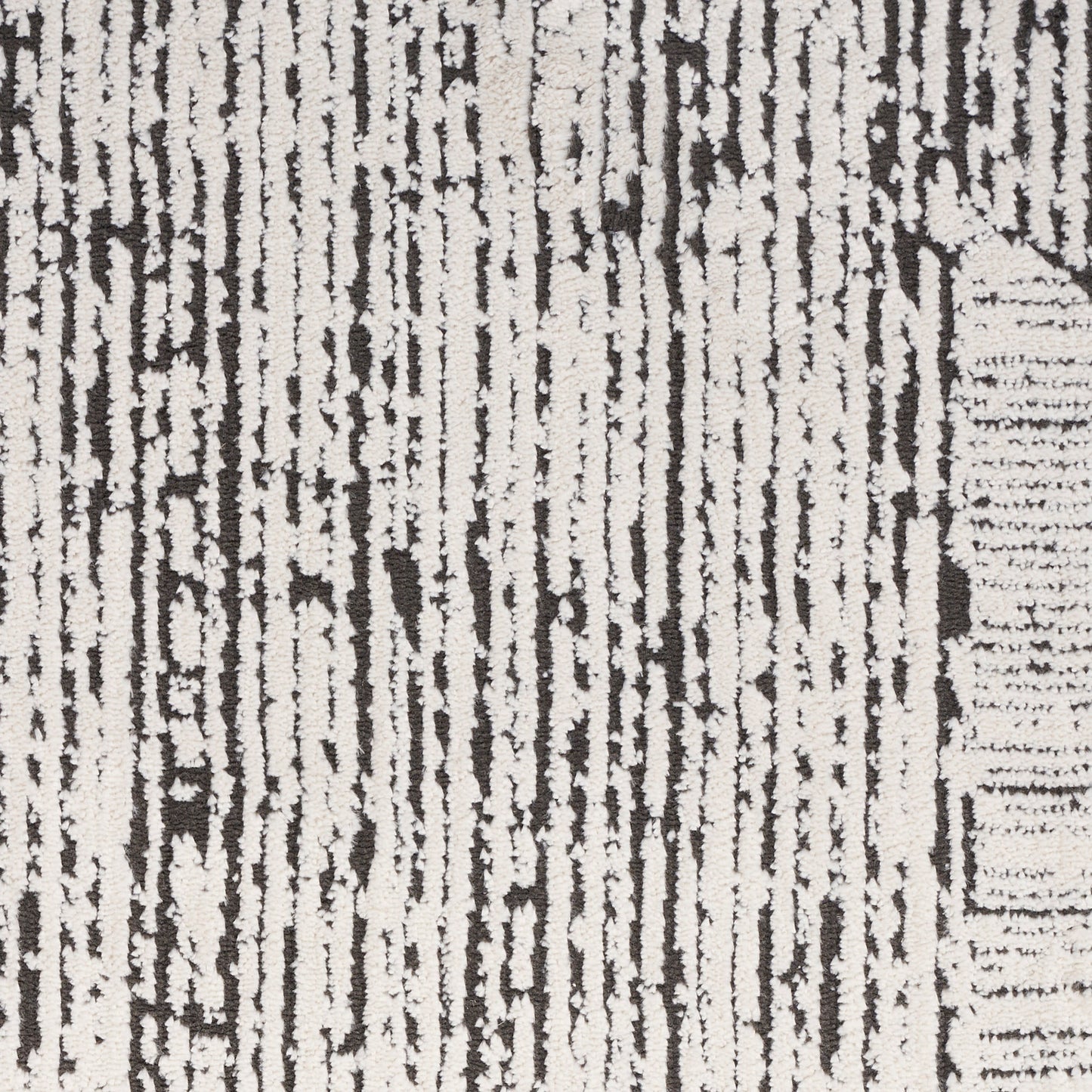 Ivory and black woven rug with irregular vertical stripe pattern, modern abstract style for living room floors