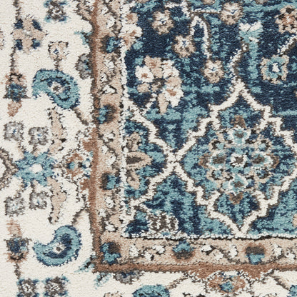 Blue and ivory oriental rug with floral medallion pattern and tan-brown border; plush textured pile.