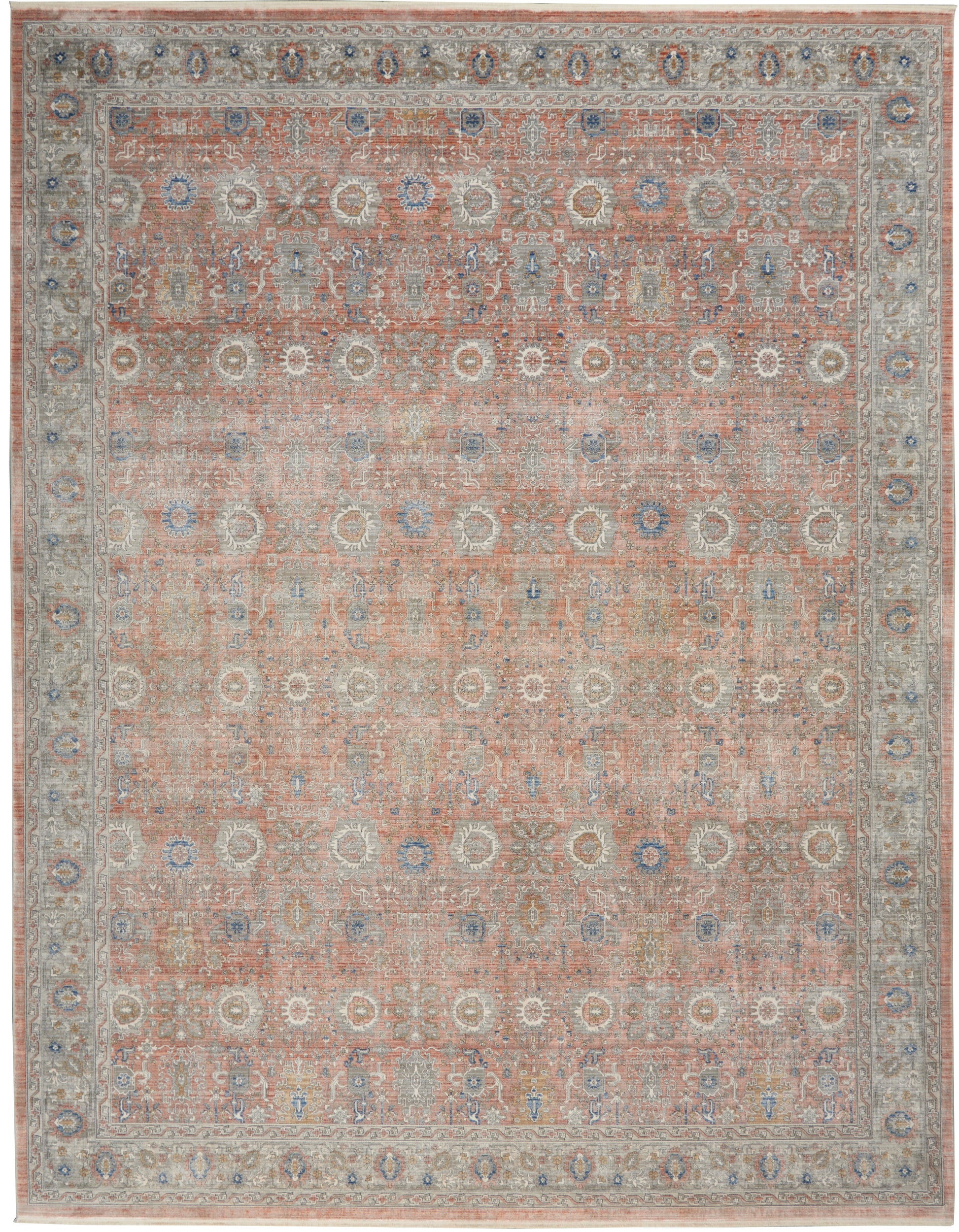 Cozy traditional oriental rug with peach field, blue and ivory floral medallions, and pale gray border.