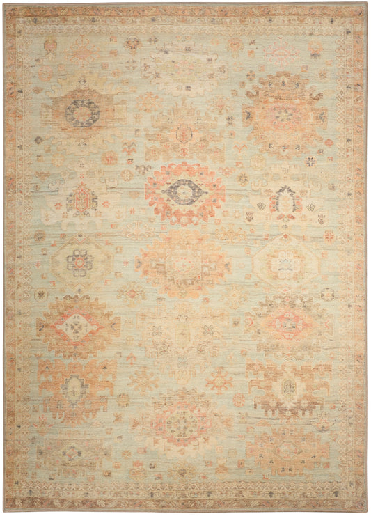Rectangular traditional oriental-style rug in beige with faded pink, peach and light blue geometric medallion motifs.
