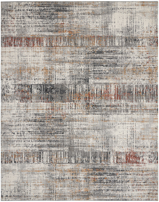 Abstract distressed area rug in cream, gray, rust and black with layered brush-stroke and grid patterns.