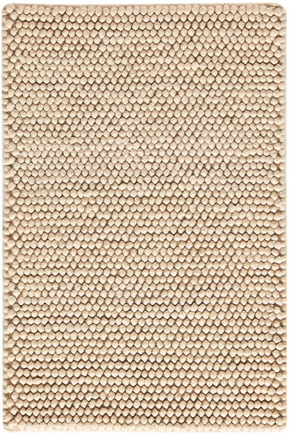 Beige loop-pile bath mat; rectangular, soft textured rug for bathroom.