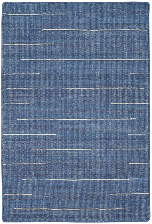 Blue denim-style rug with irregular white stitch lines, rectangular, casual modern decor.