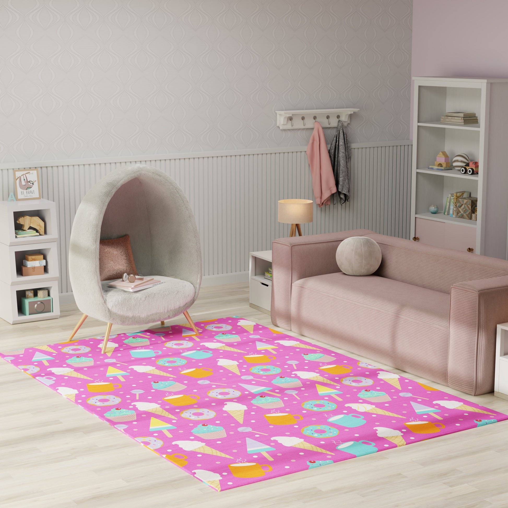 Pink kids' rug with pastel donuts and ice-cream cones; playful room with an egg chair and pink sofa.