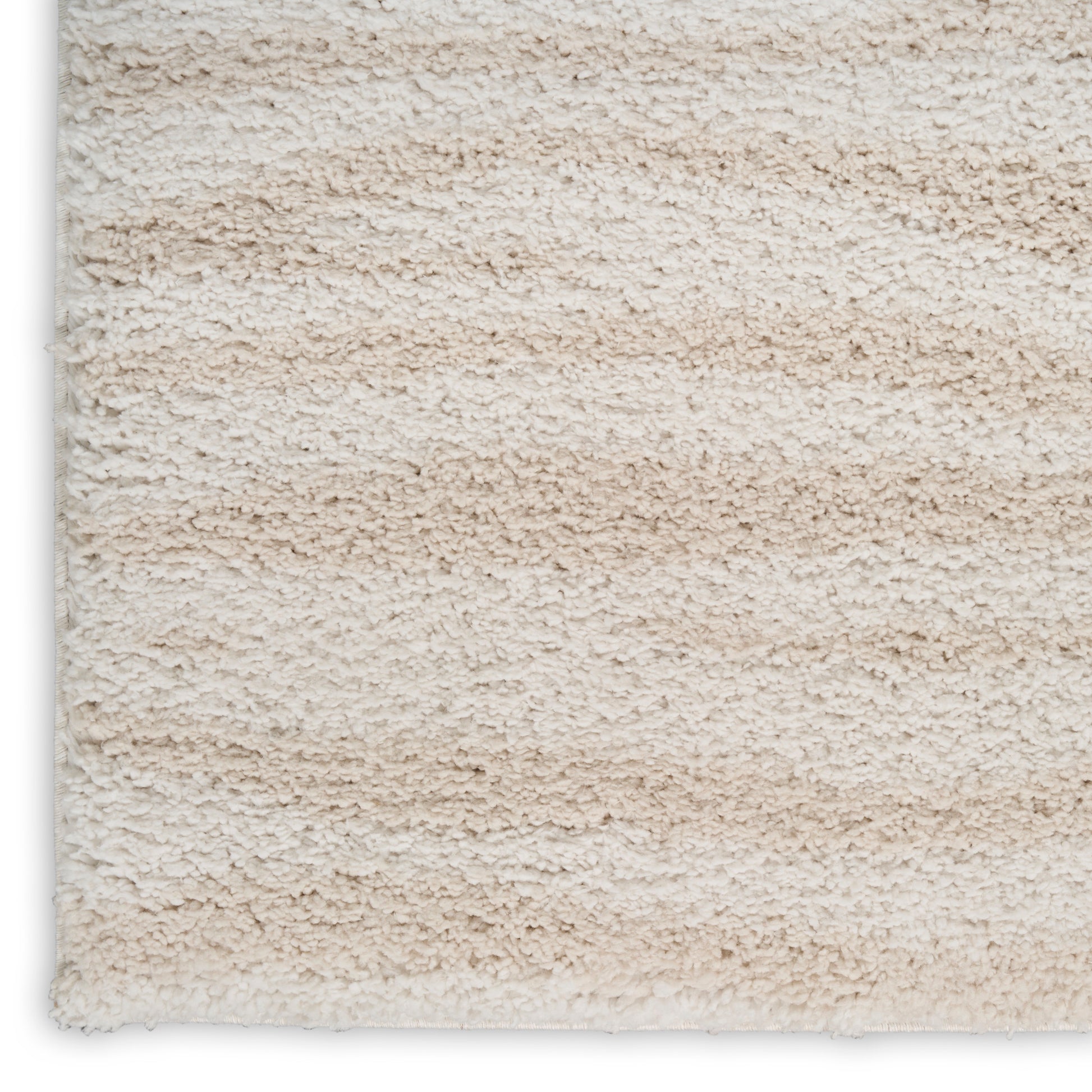 Beige cream high-pile shag rug with soft fluffy fibers; close-up texture.