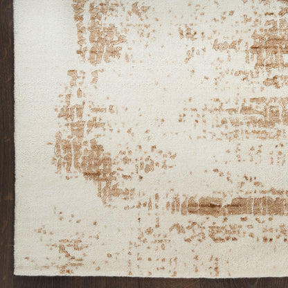 Rectangular cream area rug with tan-brown distressed pattern and dark brown left border.