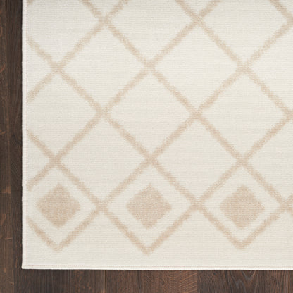 Cream rectangular rug with beige diamond lattice pattern, flat-weave, decorative floor piece on dark wood.