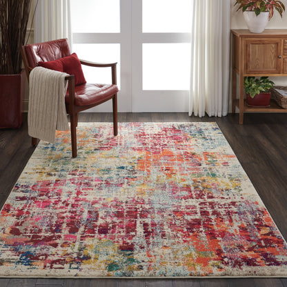 Colorful abstract-pattern rug in a cozy living room with a red leather chair, beige throw, and wooden cabinet.