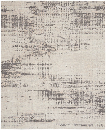 Abstract beige area rug with distressed gray pattern, modern rectangular design.