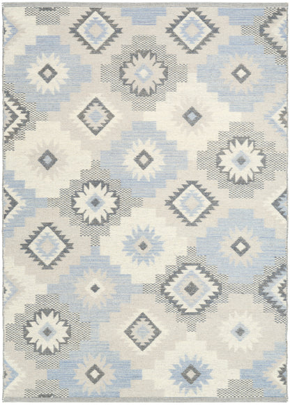 Flat-weave rug with Navajo-inspired diamond motifs in light blue, gray, and ivory on a cream background.