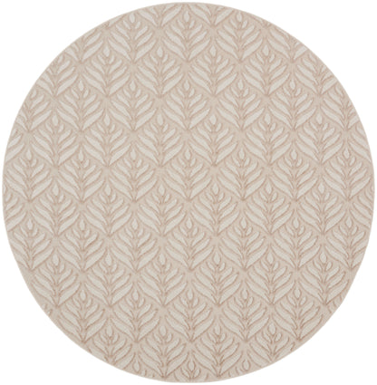 Round beige rug with subtle raised taupe leaf motif.