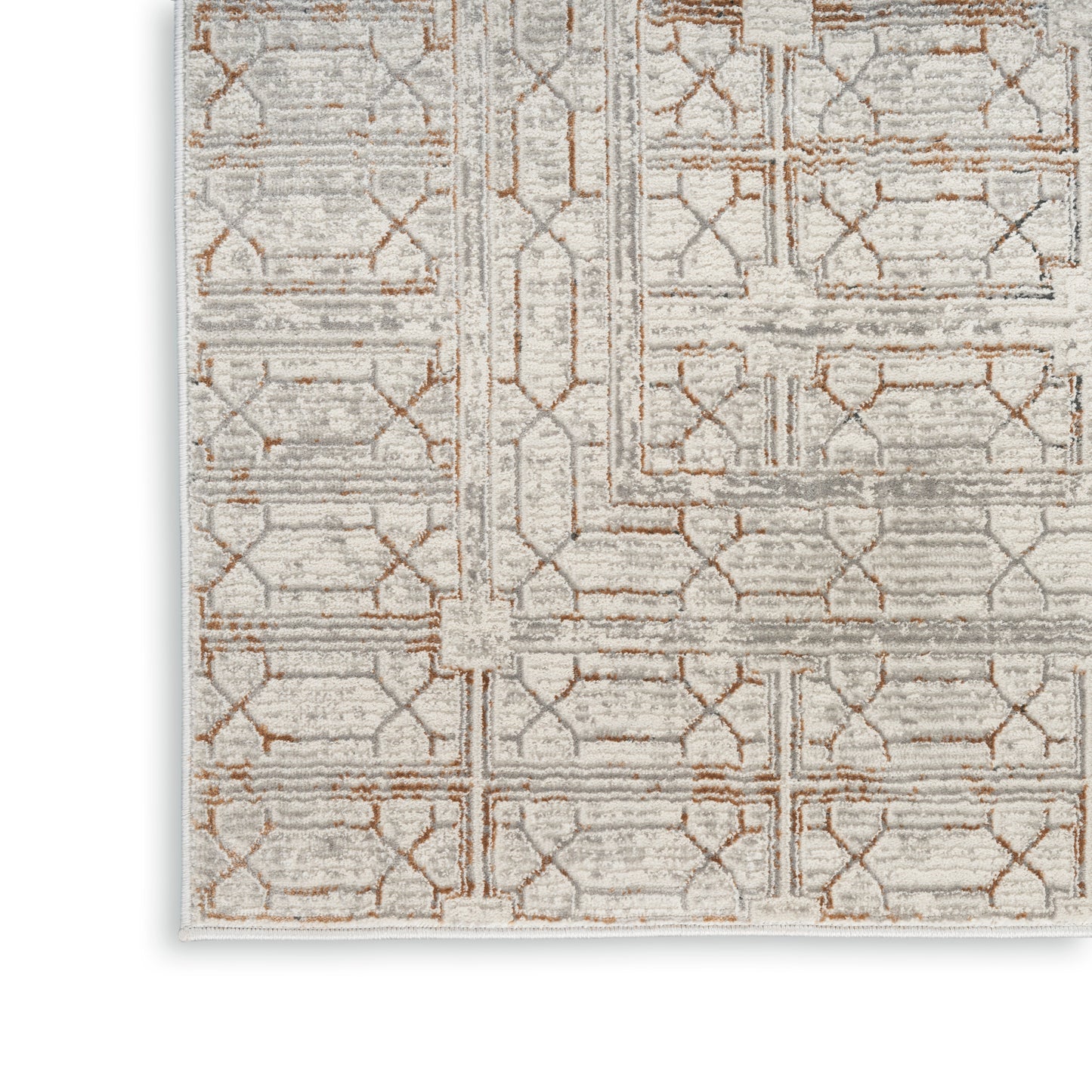 Rectangular area rug in soft gray and beige with tan geometric trellis pattern, low-pile and modern textured look.