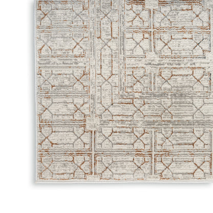 Rectangular area rug in soft gray and beige with tan geometric trellis pattern, low-pile and modern textured look.