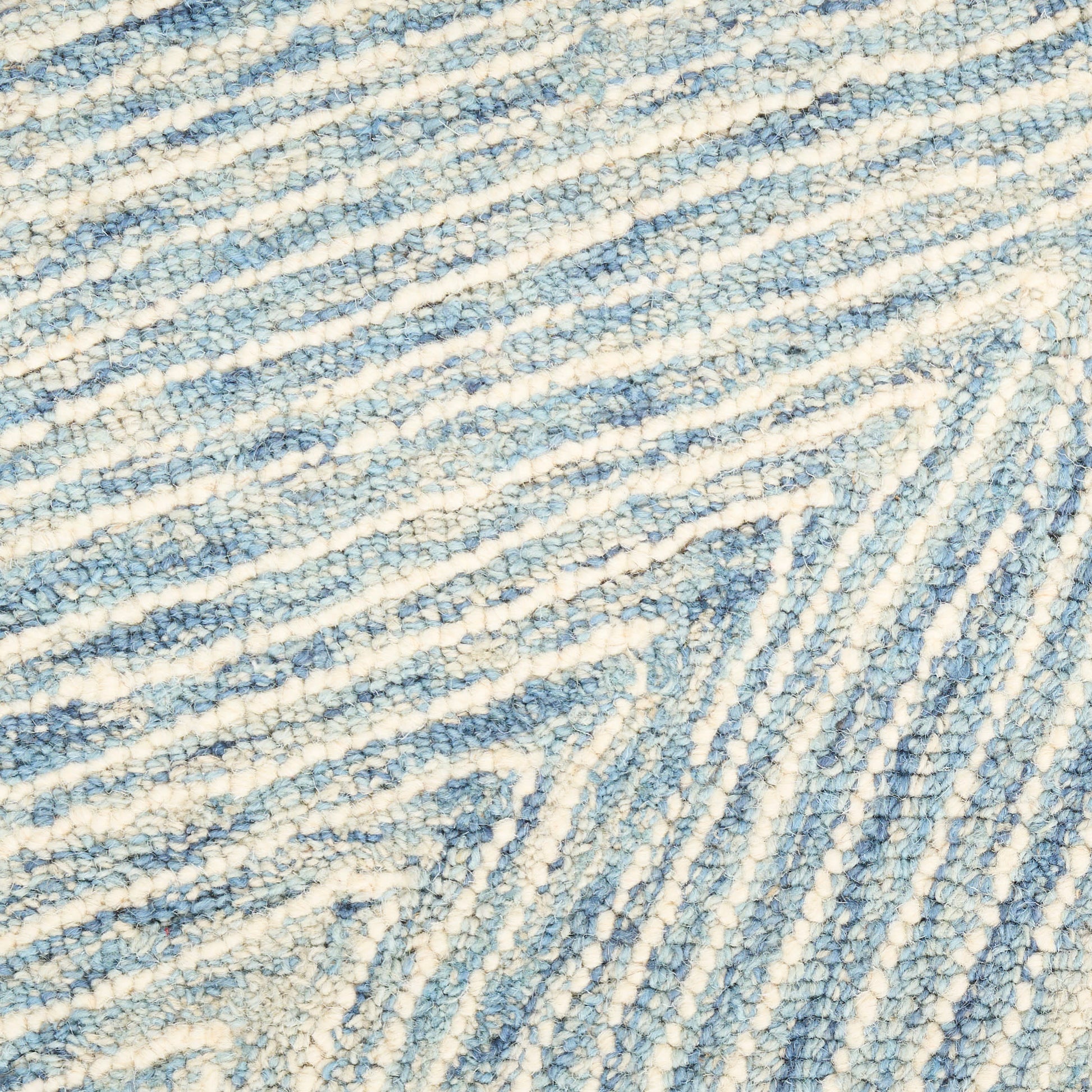 Blue and ivory woven rug texture with soft looped fibers and diagonal striped pattern; cozy underfoot.