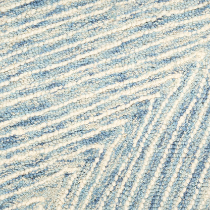 Blue and ivory woven rug texture with soft looped fibers and diagonal striped pattern; cozy underfoot.