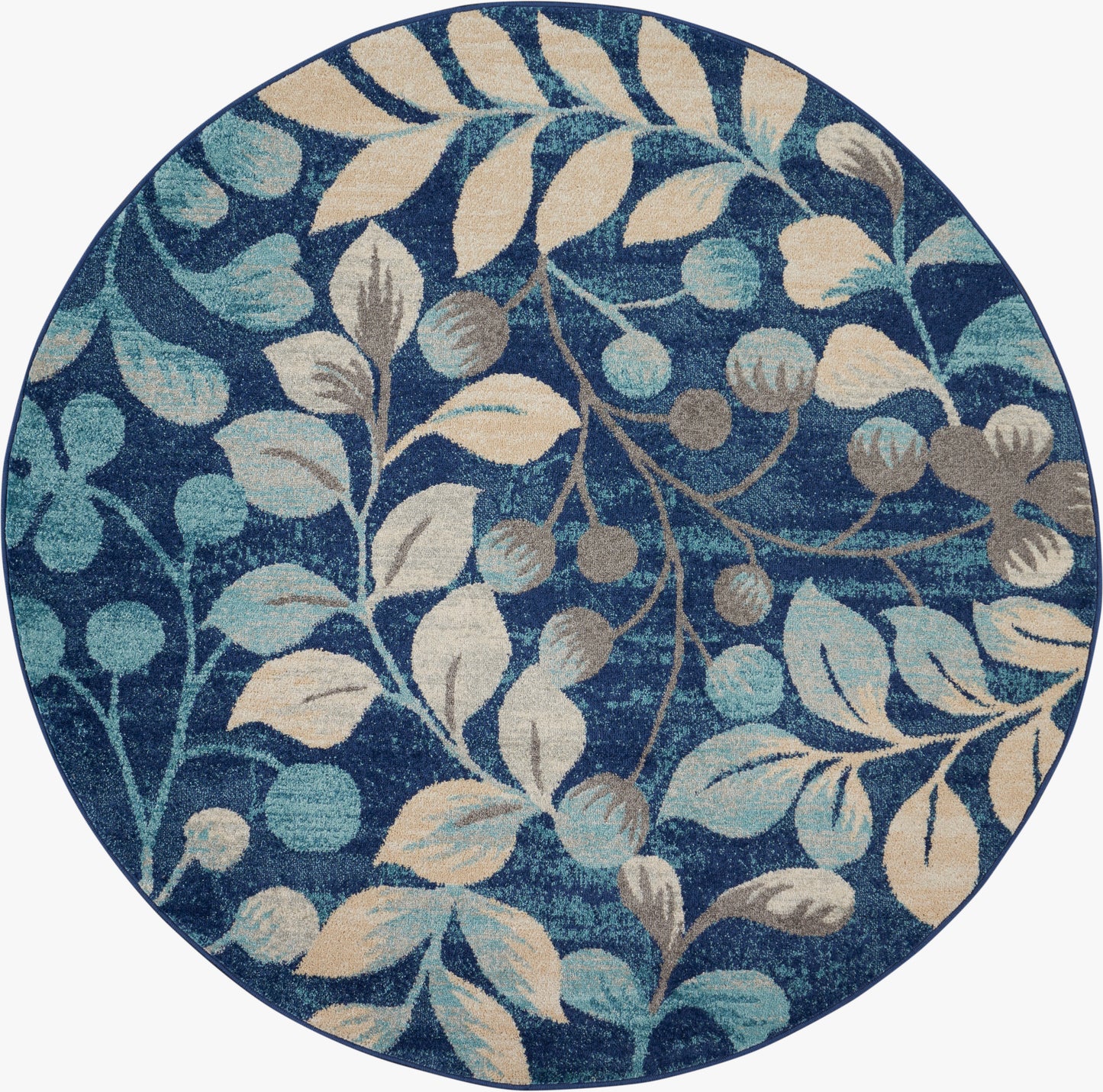 Round blue rug with cream and teal botanical leaves and berries; decorative floor accent.