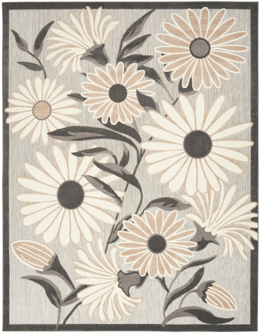Neutral-tone area rug with large beige daisies, dark centers, gray background and charcoal border.