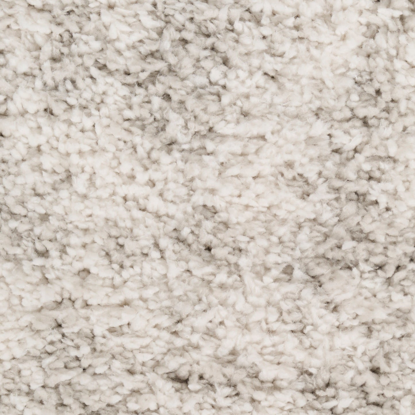 Cream beige plush shag rug close-up with dense high-pile fibers, soft and cozy for living areas.