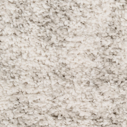 Cream beige plush shag rug close-up with dense high-pile fibers, soft and cozy for living areas.