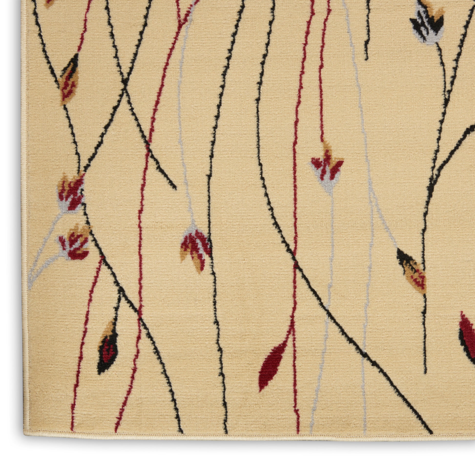 Beige area rug with abstract black and red curved lines and pale gray vertical threads, leaf accents.