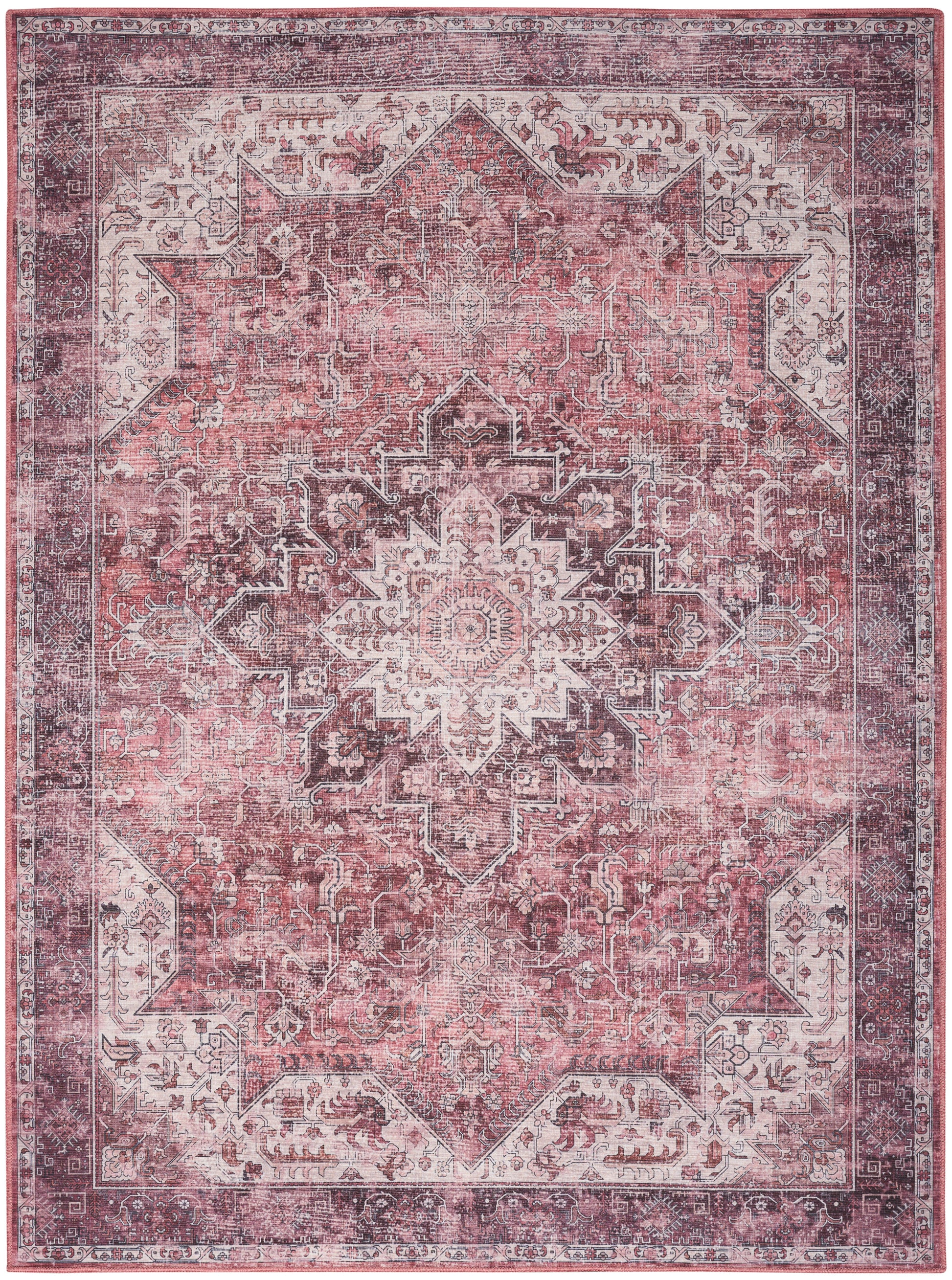 Distressed pink Persian-style area rug with ivory central medallion, ornate border and vintage floral motifs.