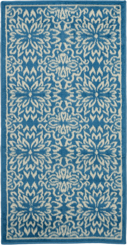 Rectangular blue & white woven runner rug with repeating floral-geometric motif & dark blue border.
