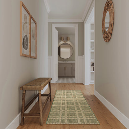 Entry hallway with wooden bench, green patterned runner, gray walls, white wainscoting, and a circular wicker mirror.