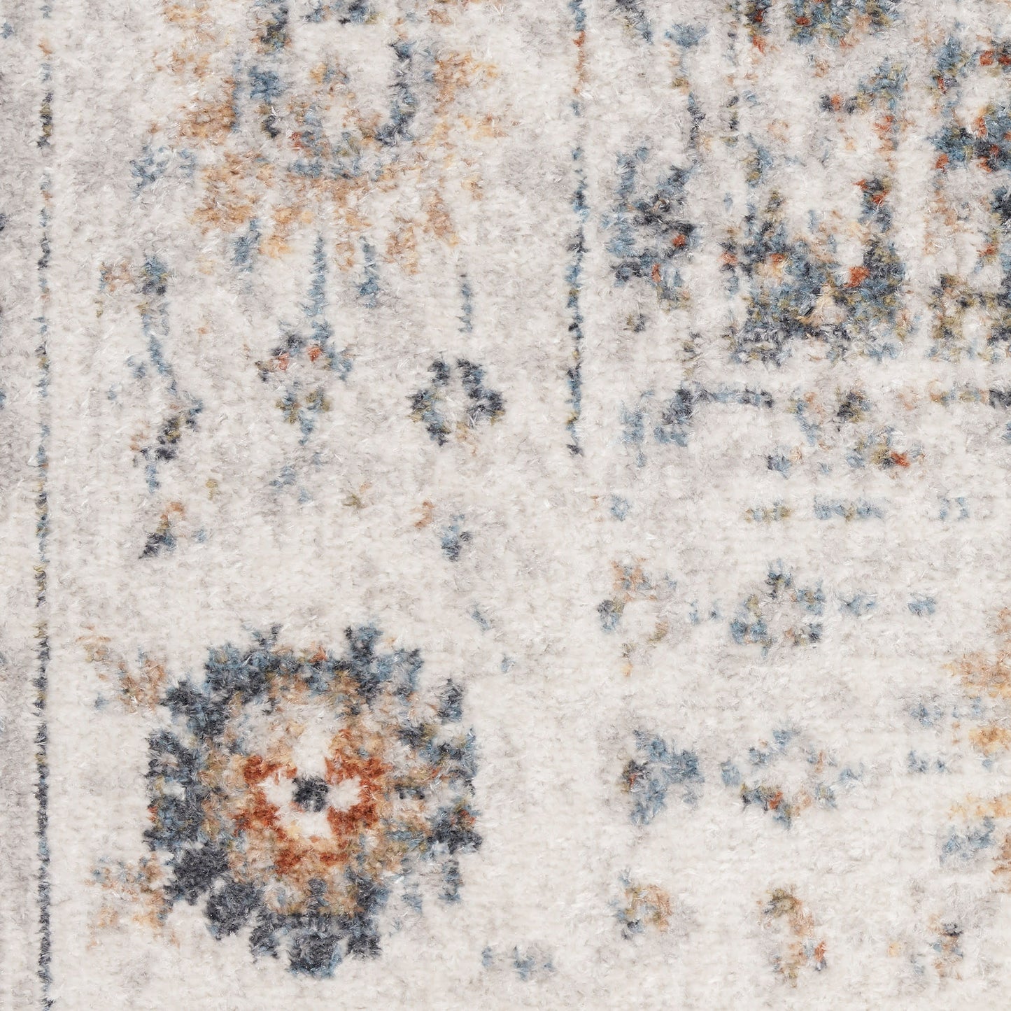 Distressed beige oriental rug with blue & rust circular medallions; vintage look, soft pile for living room decor.