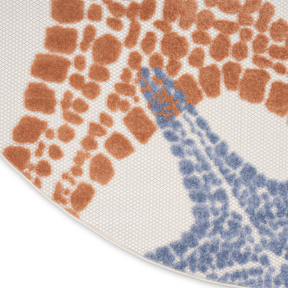 Round rug with orange abstract spots and blue curved motif on cream background.