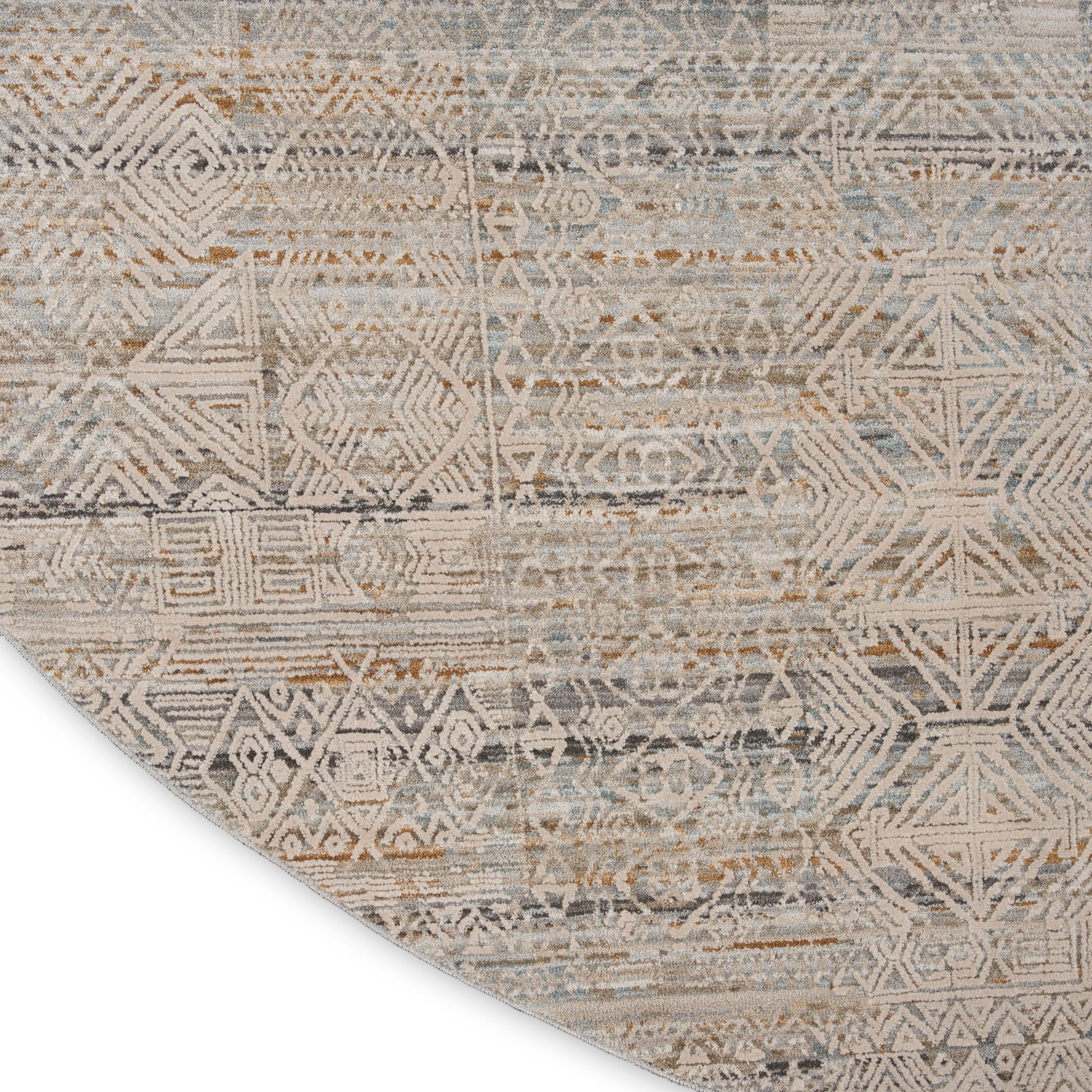 Round distressed area rug with geometric tribal pattern in beige, taupe, and blue-gray.