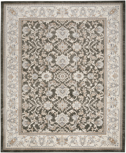 Ornate oriental-style rug with a dark central field of ivory-blue floral damask, framed by a pale ivory floral border.