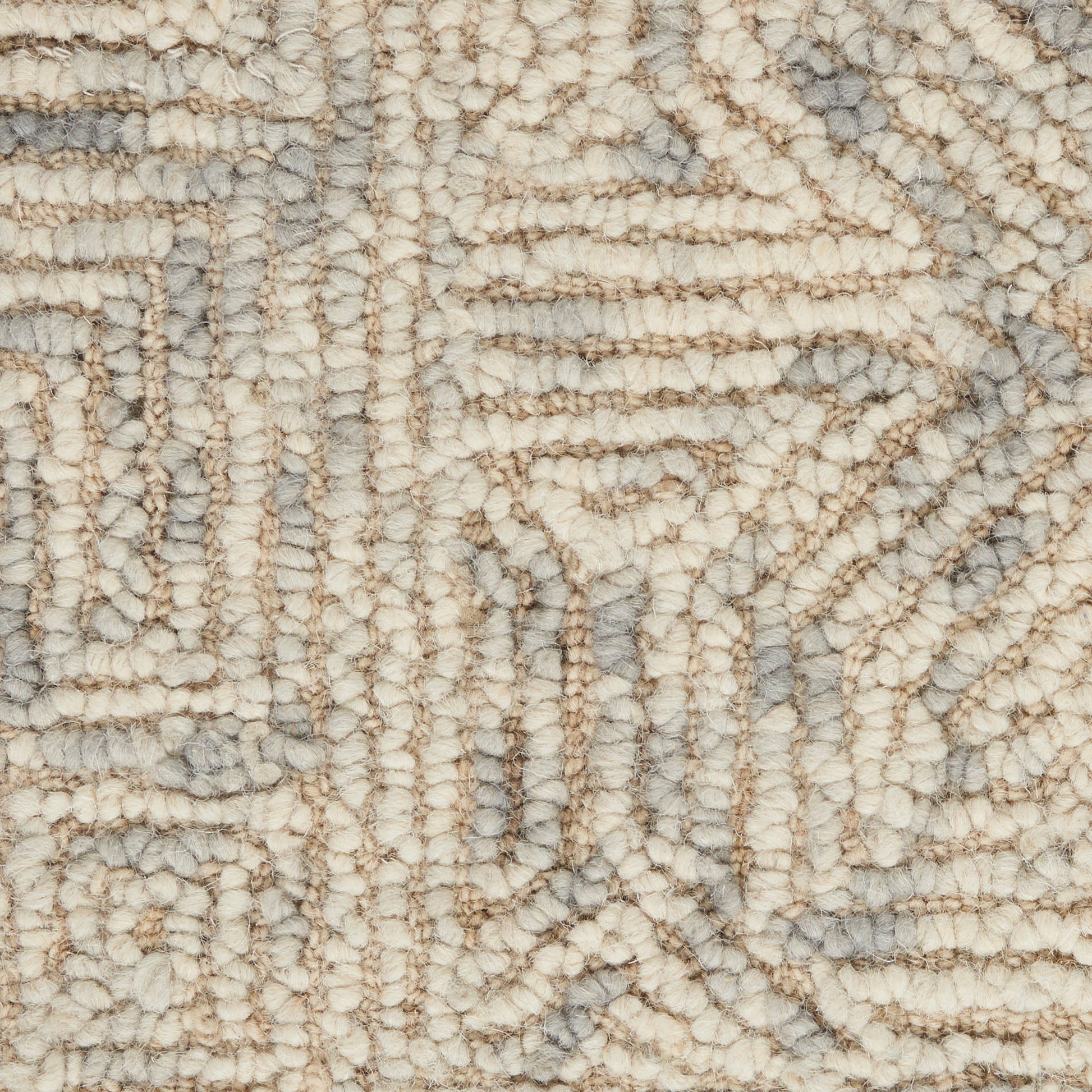 Close-up of a beige & gray geometric rug with looped, tufted pile & soft, textured surface.