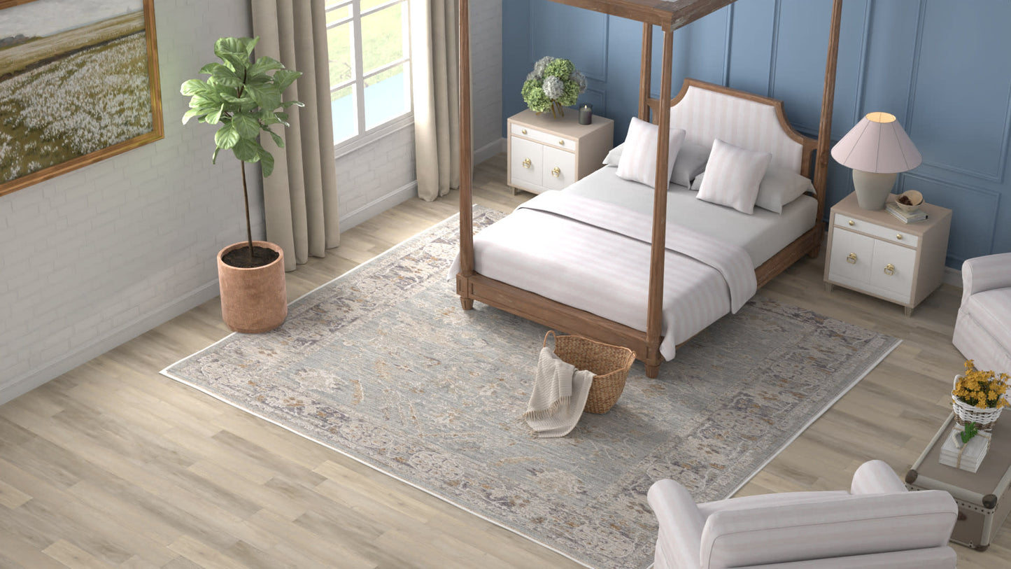 Wood four-poster bed with white linens on a light patterned rug, blue paneled walls, white nightstands and a potted plant.