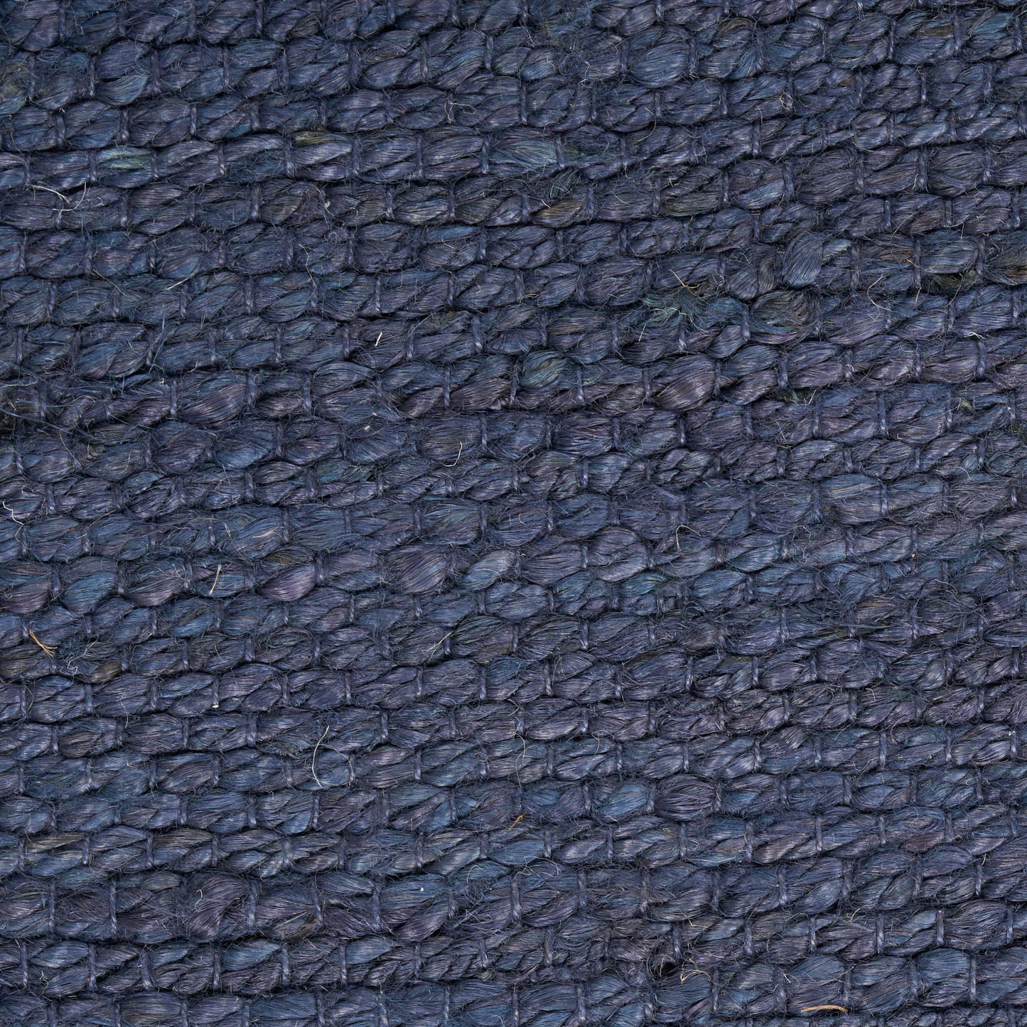 Dark blue pebbled leather texture close-up.