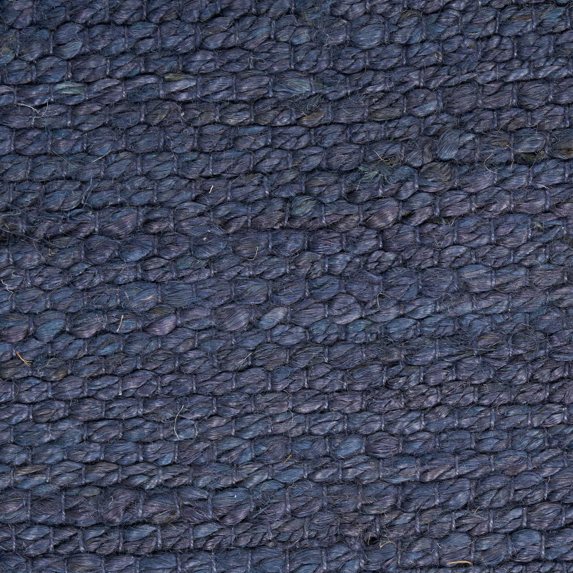 Dark blue pebbled leather texture close-up.