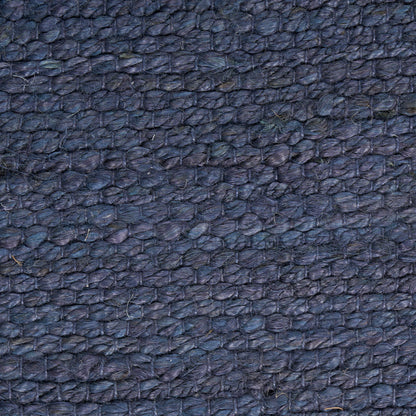 Dark blue pebbled leather texture close-up.