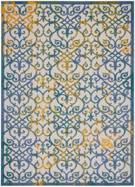 Decorative area rug with blue teal scrollwork on a light beige background, orange accents, and a dark blue border.