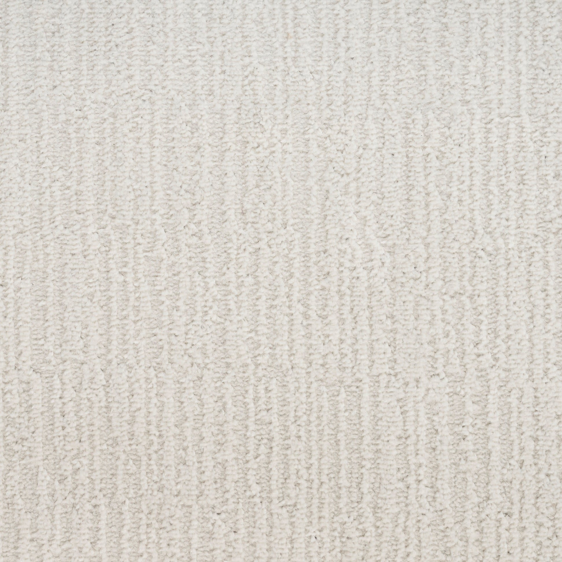 Cream-beige textured carpet with vertical loop pile pattern and soft plush feel.