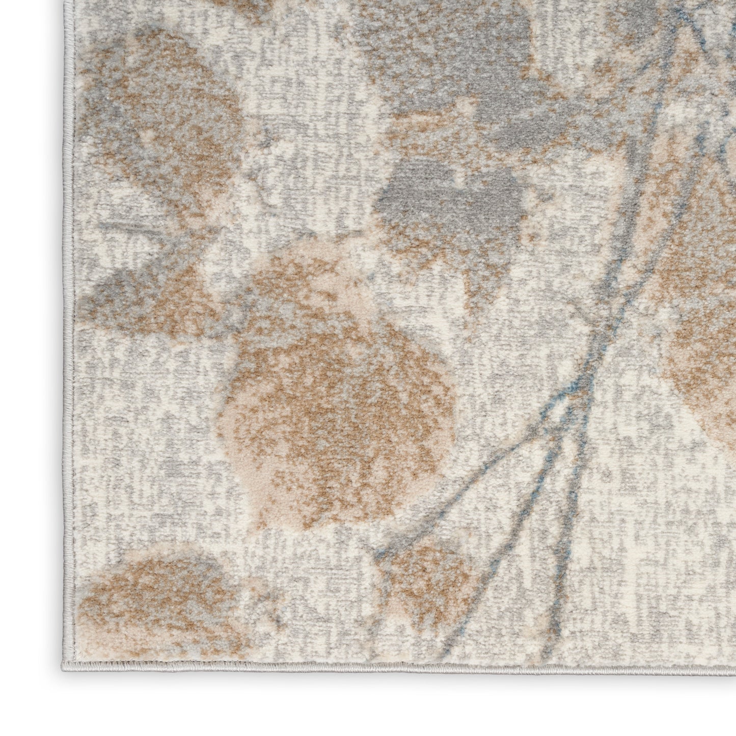 Textured beige rug with tan floral motifs, gray shading and subtle blue stems; rectangular, cozy home decor.