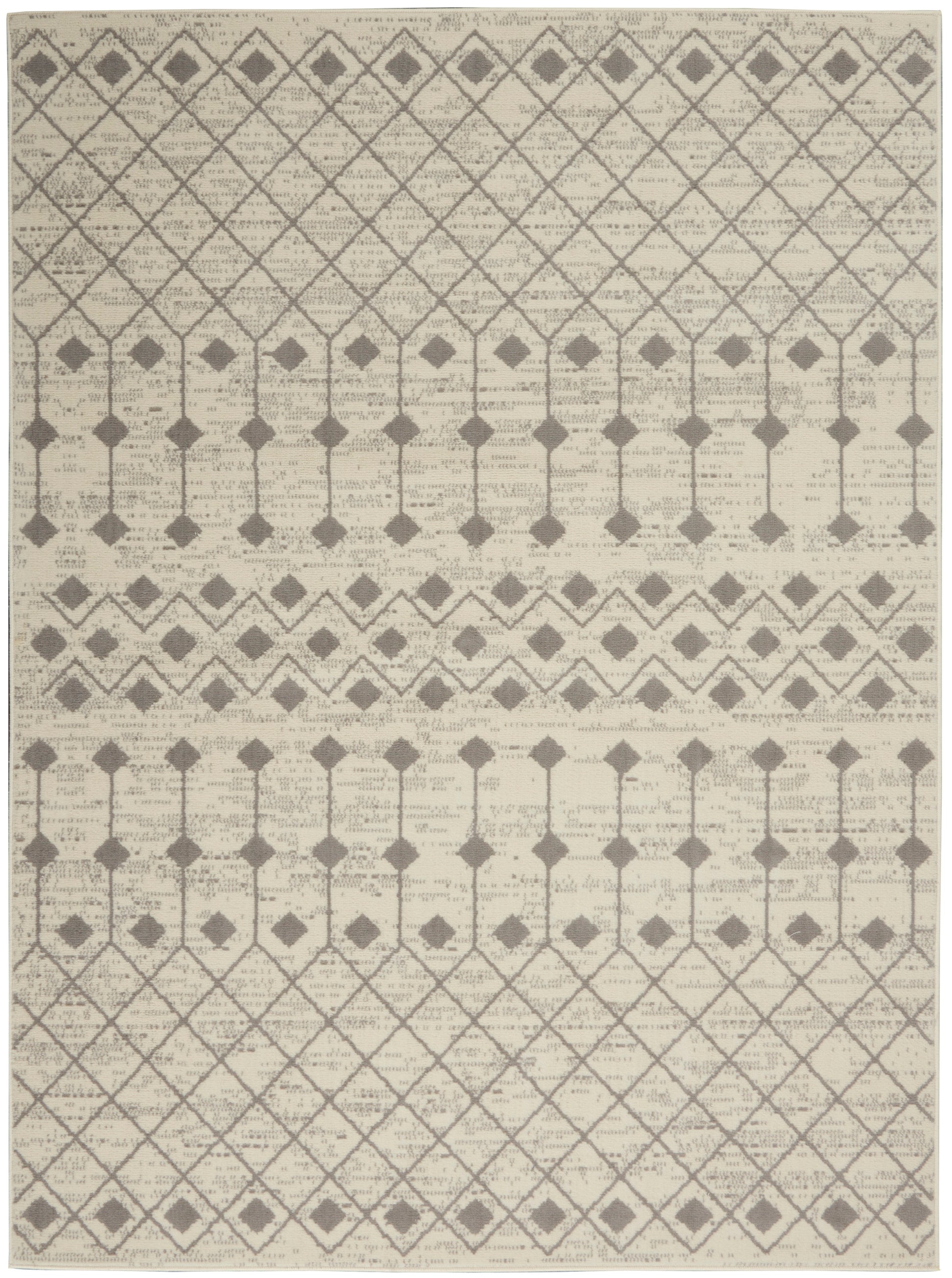 Beige area rug with gray geometric lattice, diamond motifs and vertical stem patterns with chevron bands.