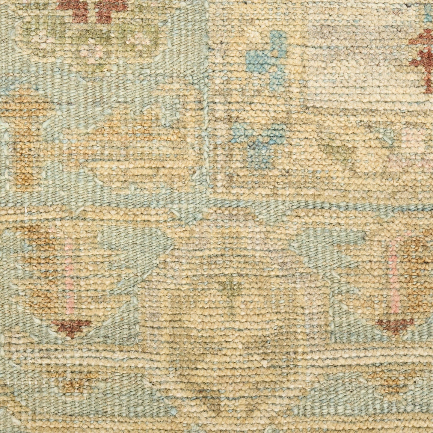 Beige and light blue woven rug with subtle floral medallion patterns; distressed look, soft pile for living room decor.