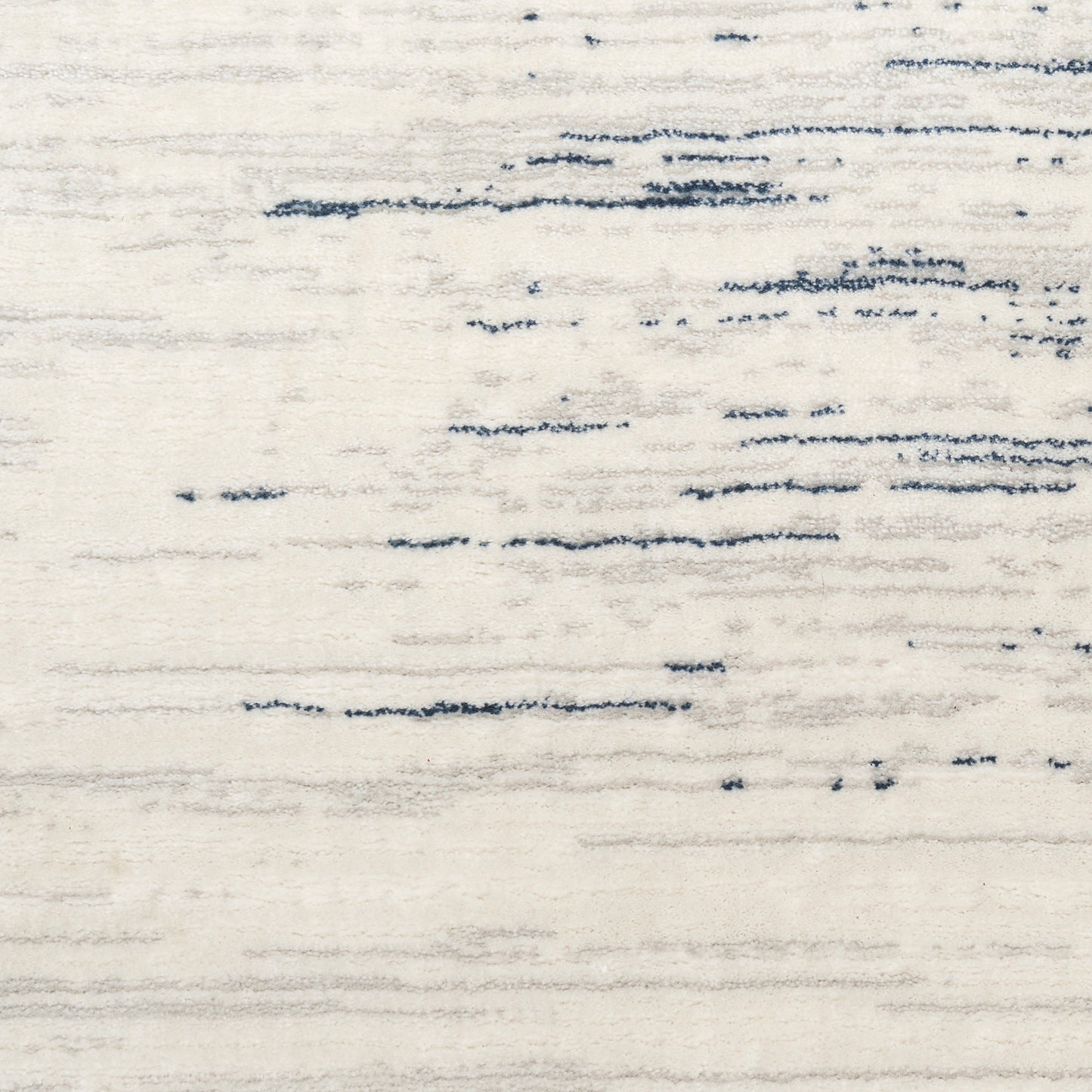Beige textured area rug with irregular blue brushstroke lines; modern abstract style for living room.