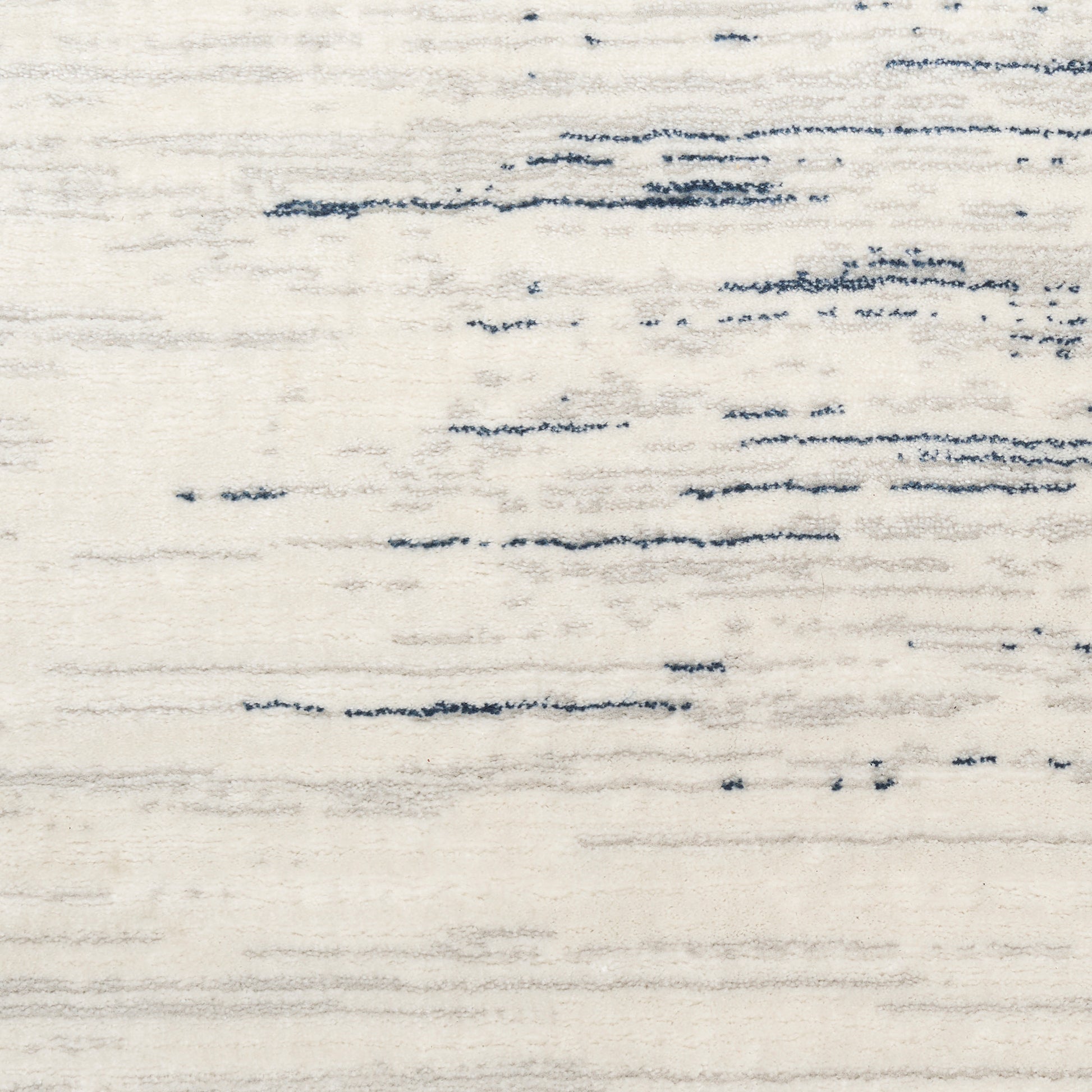 Beige textured area rug with irregular blue brushstroke lines; modern abstract style for living room.