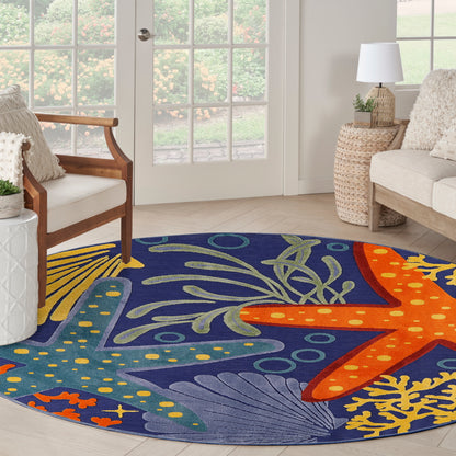 Round blue outdoor area rug with orange starfish and seaweed motif and coral accents.