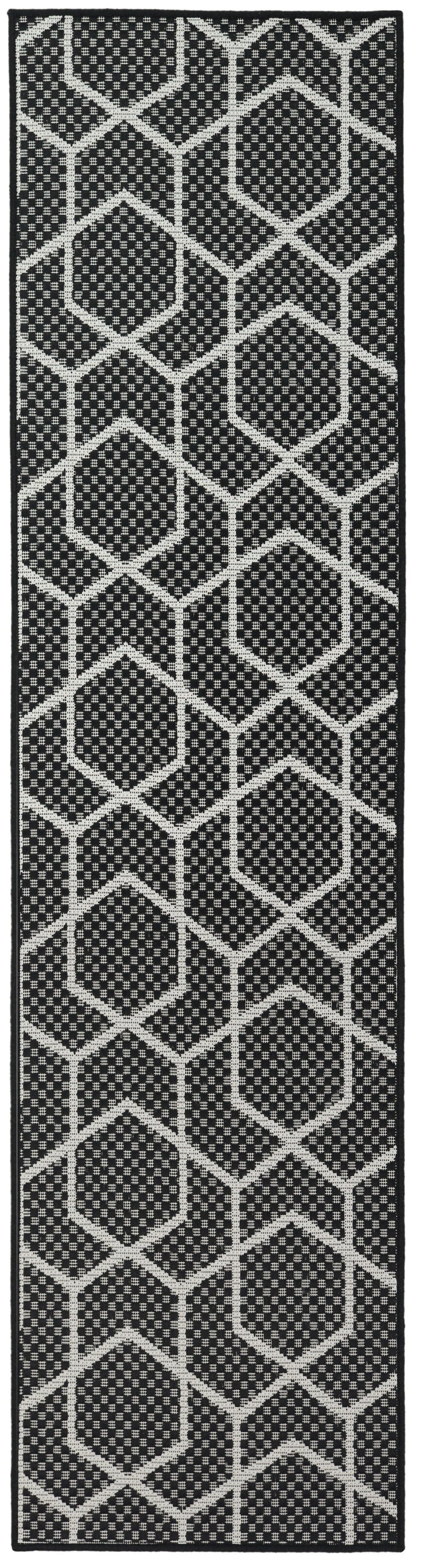Black rug runner with white hexagon lattice pattern and dotted inner texture.