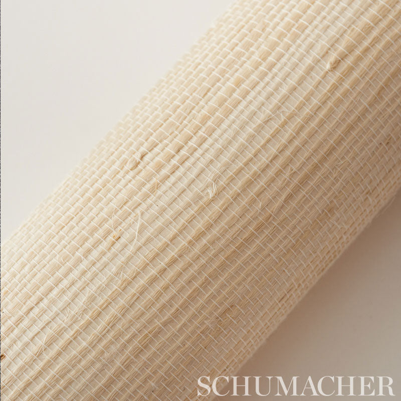 Beige woven fabric roll with tight crosshatched grid; jute-like texture, ideal for blinds or upholstery.
