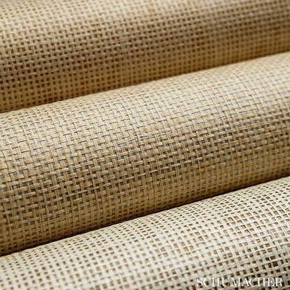 Beige pearl woven fabric roll with a coarse grid weave; natural upholstery or craft material.
