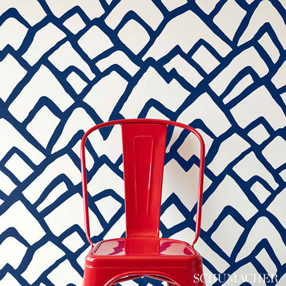 Soft chartreuse wallpaper with an exuberant geometric pattern.